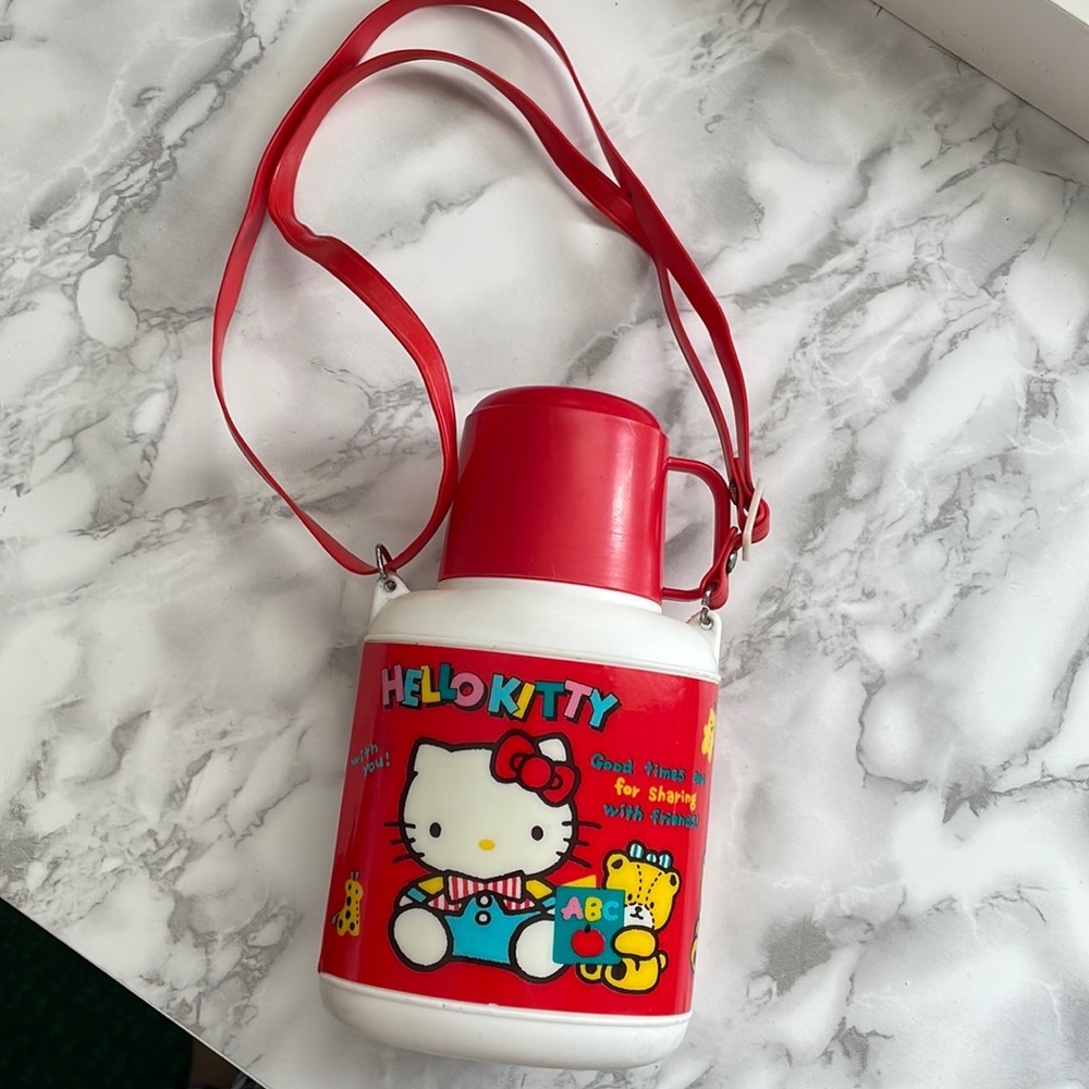 Vintage Sanrio 1988 Hello Kitty water bottle with original strap and cup
